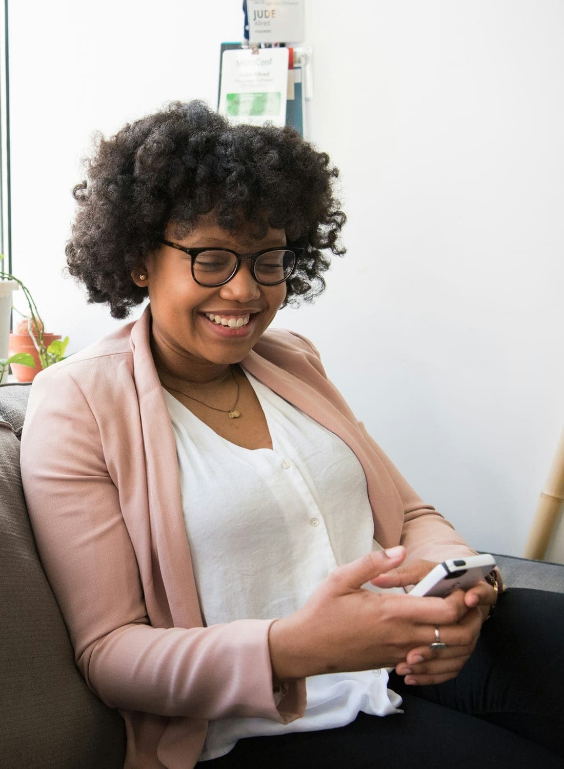 An ElevatePay customer checking her balance on her phone